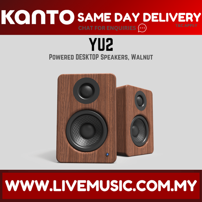 Walnut powered desktop speakers with black tweeter and woofer drivers, angled view