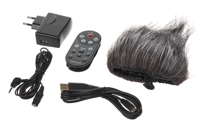 H6 accessory pack components: power adapter, remote, cables, and furry microphone windscreen