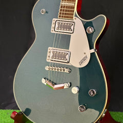 Jade grey metallic single-cut electric guitar with two humbucker pickups and V-stoptail