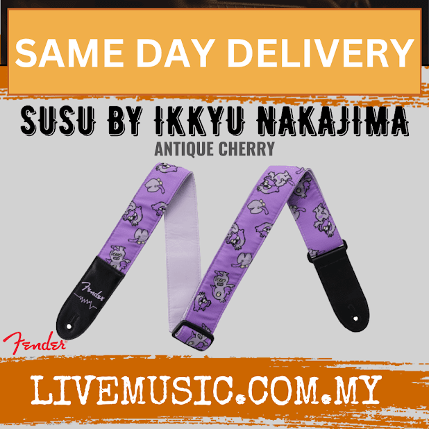 Purple patterned guitar strap with cartoon design and black leather ends