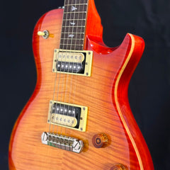 Vintage sunburst electric guitar showing dual pickups, bridge, and chrome hardware