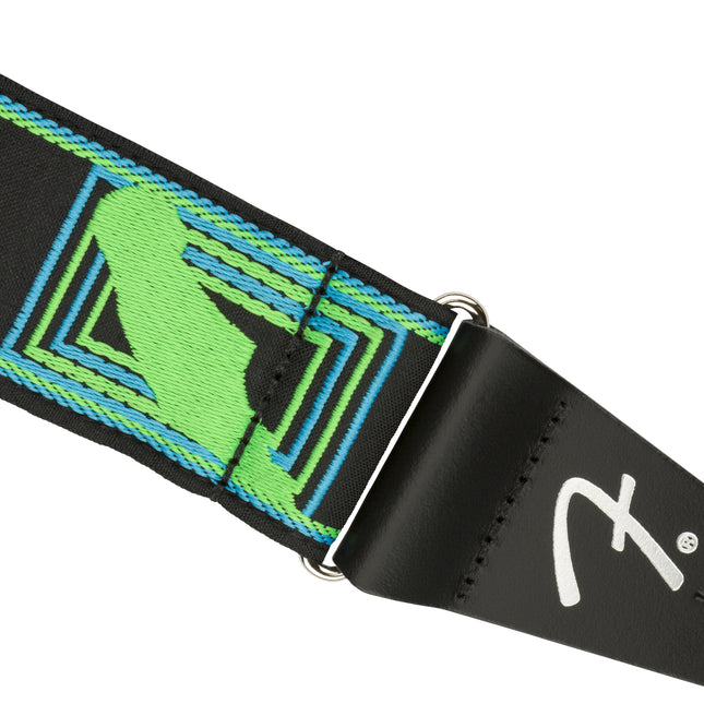 Fender neon monogram guitar strap end with black strap, metal ring buckle, and neon pattern