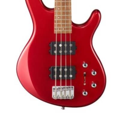 Red electric bass body close-up with pickups, bridge, and four strings