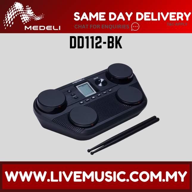 Black portable tabletop electric drum with 4 pads, built-in speaker, and drumsticks.