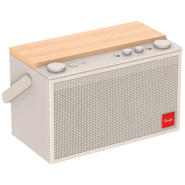 White portable Bluetooth speaker front view with speaker grille and top control knobs