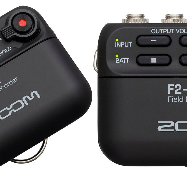 Black Zoom F2 field recorder, angled view of control panel and front with red control light