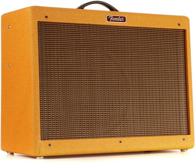 Tweed tube guitar combo amplifier front view with grille and Fender badge